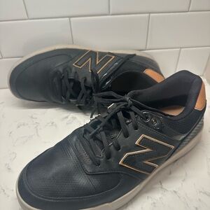 NEW BALANCE - Style 574 black leather greens turf spikeless shoe.